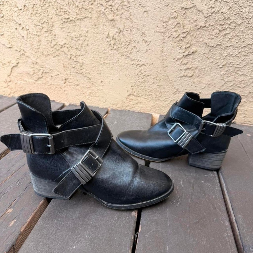 Black leather ankle boots with buckle detail